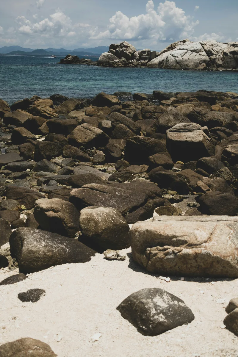 Rocky shoreline meeting the sea in Sanya